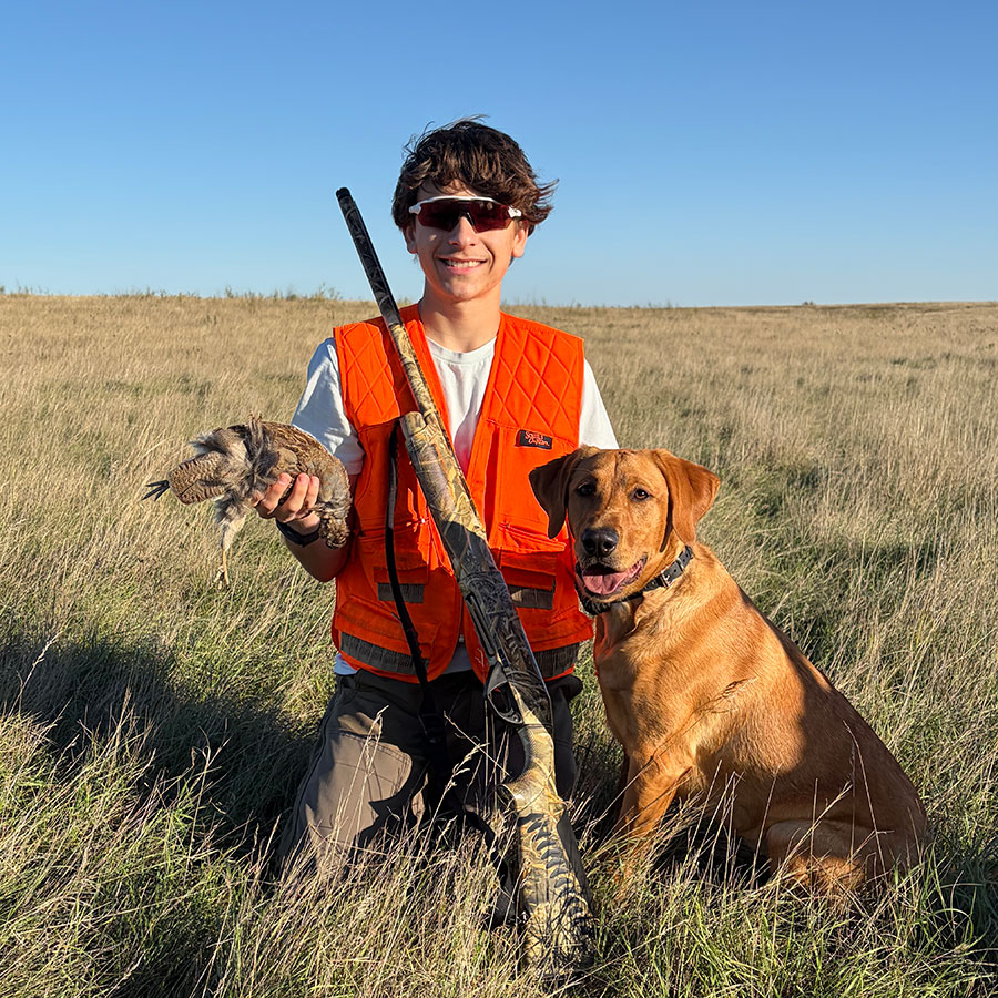 Hunter and dog with harvested bird