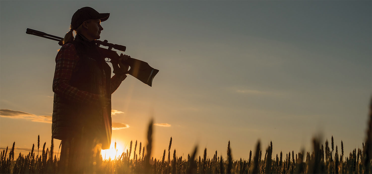 Hunter in the field at sunrise