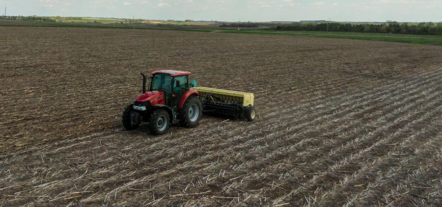 Tractor plowing field on WMA