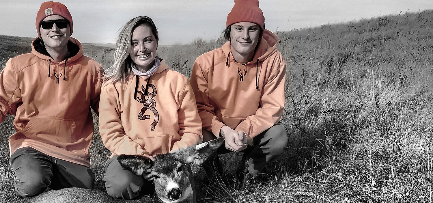 The Wilson boys, Nate (left) and Jack, pose with their sister, Lauren, and her first deer shot a handful of years ago.