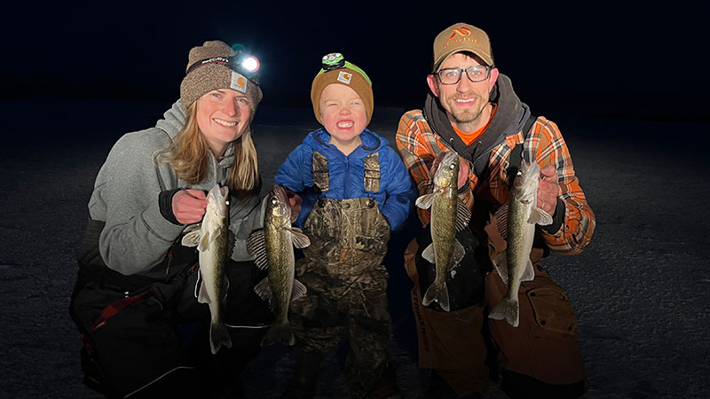 Cayla, Fischer, Scott posing with fish they caught