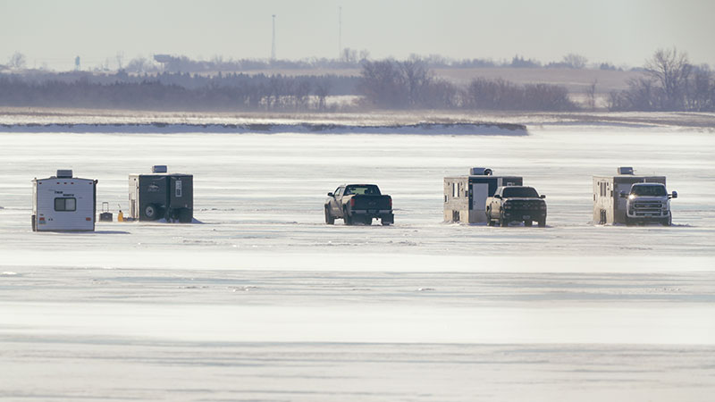 Fish houses on an iced over lake