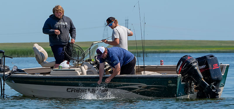 People fishing from a boat
