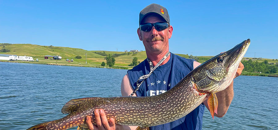 Angler holding fish he caught