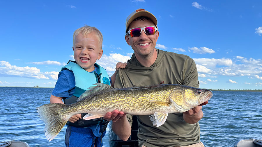 Father and son with fish they caught