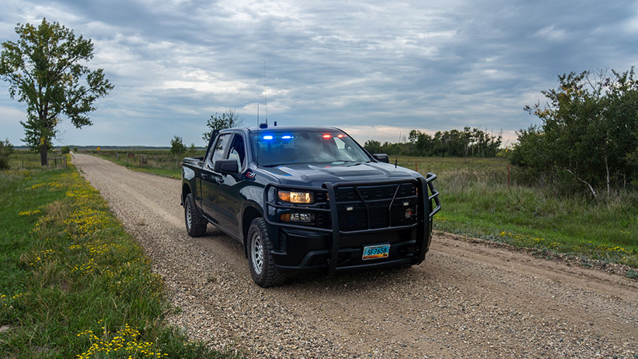 Warden truck with flashing lights