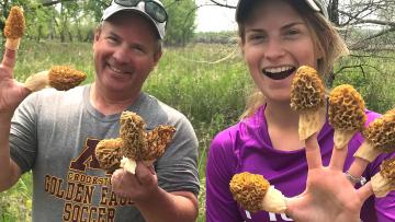 Post author (right) and friend with morel mushrooms on their fingers