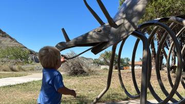 Fisch and dinosaur statue