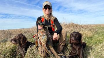Cayla with dogs and harvested birds
