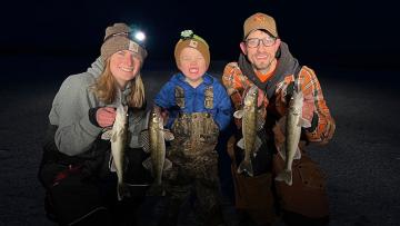 Cayla, Fischer, Scott posing with fish they caught