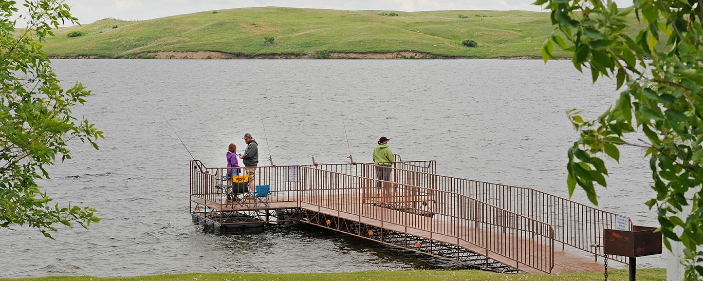 Anglers fish from a fishing pier at Lake Josephine in Kidder County. Like a lot of waters in North Dakota, amenities such as fishing piers and boat ramps are made possible by Game and Fish partnering with other agencies and wildlife clubs.