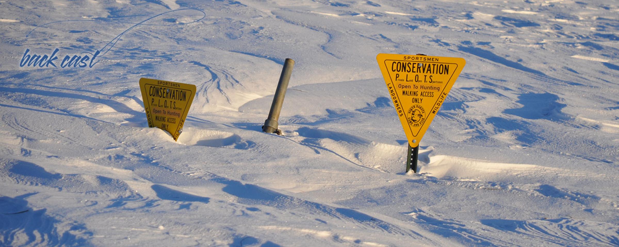 PLOTS signs in a lot of snow