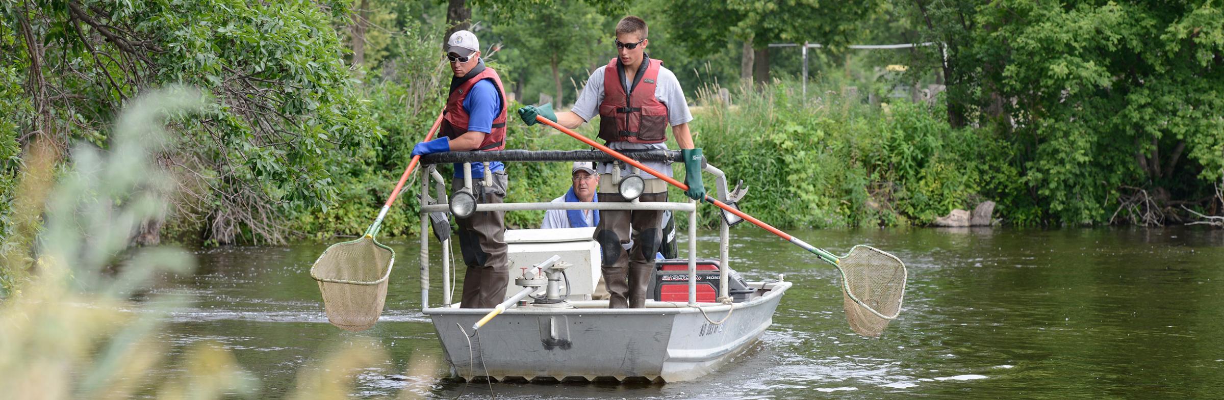 Biologists in boat