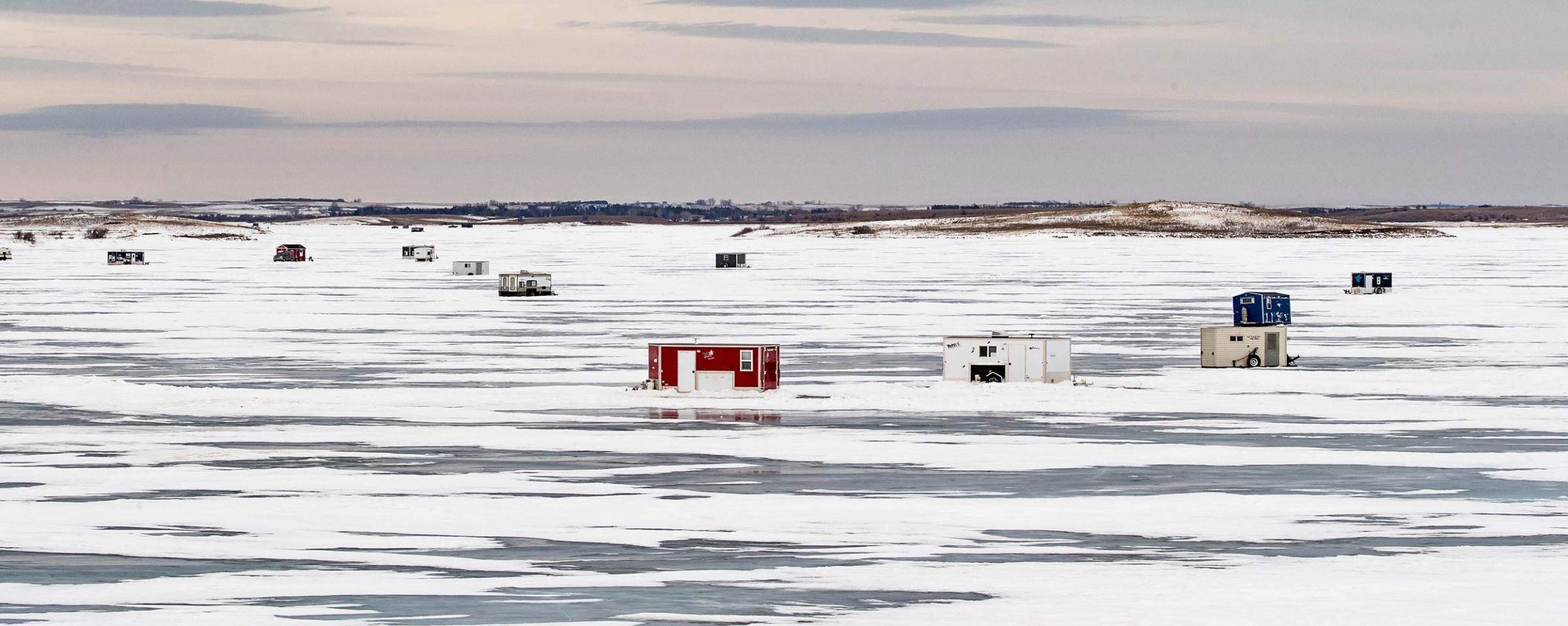 Ice houses on lake