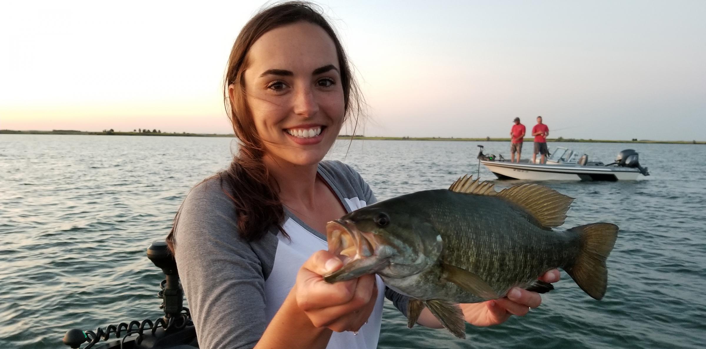 Angler holding smallmouth bass