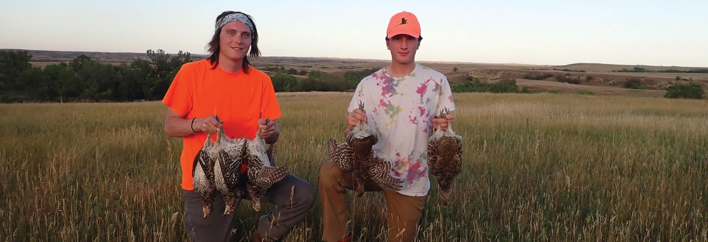 Hunters with harvested upland game birds