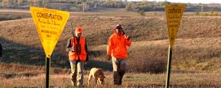 PLOTS signs and hunters