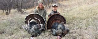 Mom and kid with turkey