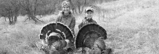 Mother and son after successful spring turkey hunt