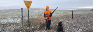 Youth with pheasant he harvested