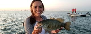 Woman with fish she caught