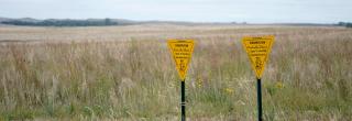 PLOTS signs in field