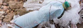 Litter - old plastic bottle on ground