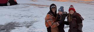 Family out ice fishing