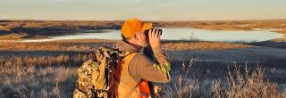 Hunter glassing near wetland