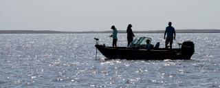 People on boat fishing