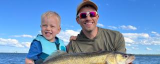 Father and son with fish they caught