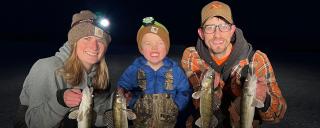 Cayla, Fischer, Scott posing with fish they caught