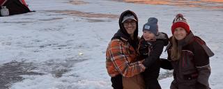 Family out ice fishing