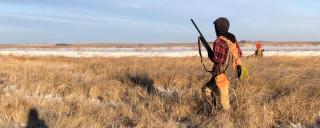 Hunters in a field