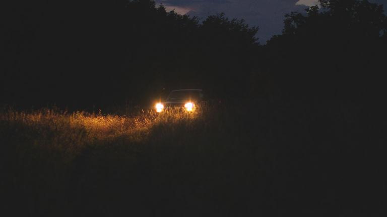 Headlights on a dark road
