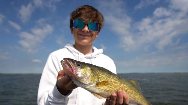 Kid holding walleye