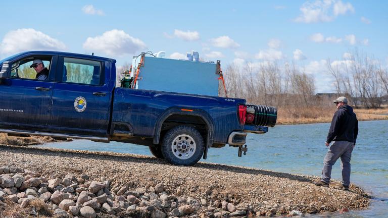 Fish stocking truck at boat ramp