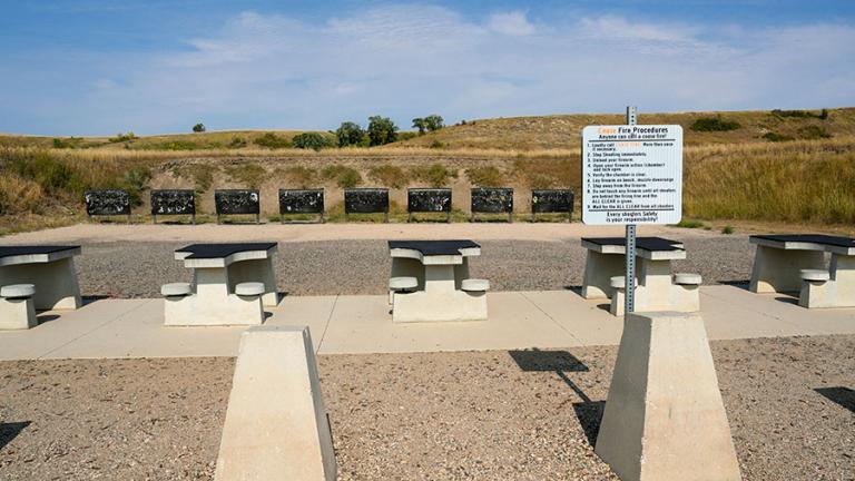 Firing range with rules sign in front