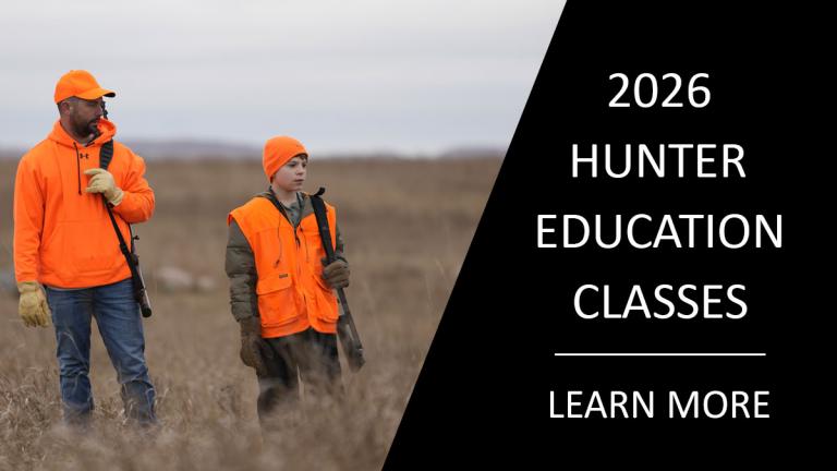 Hunter education information link (image - man and boy in the field hunting)