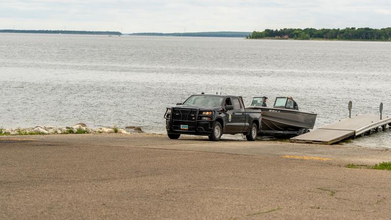 Truck and boat at launch ramp