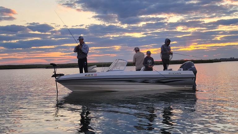 People fishing from a boat