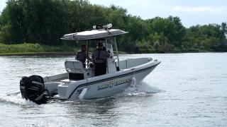 Wardens patrolling in boat