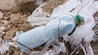 Old plastic bottle on the ground