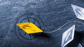 Paper boats. One yellow.