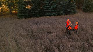 Man and two young women deer hunting