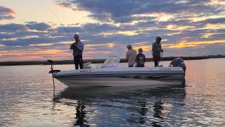 People fishing from a boat