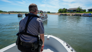 North Dakota game warden patrols the Missouri River from a boat