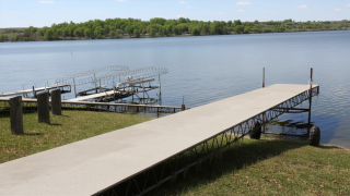 boat dock sitting on land near lake