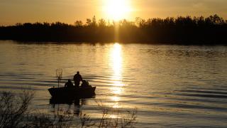 Boat on the water at sunset