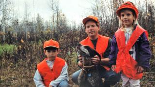 A young Calya with dad and brother